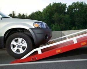 SUV Being Loaded On Tow Truck